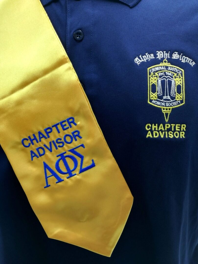 Alpha Phi Sigma advisor stole and shirt