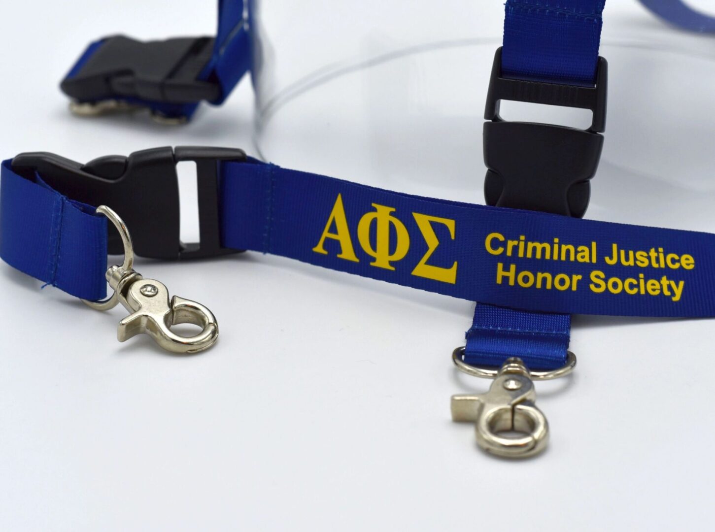 Blue lanyard with Criminal Justice Honor Society.