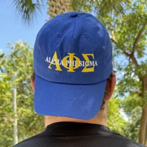 Man wearing blue fraternity hat