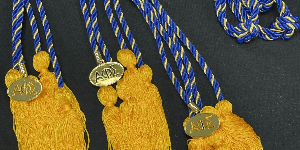 Blue and gold honor cords with medallions.
