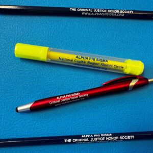 Pencils, pen, and highlighter on blue surface.